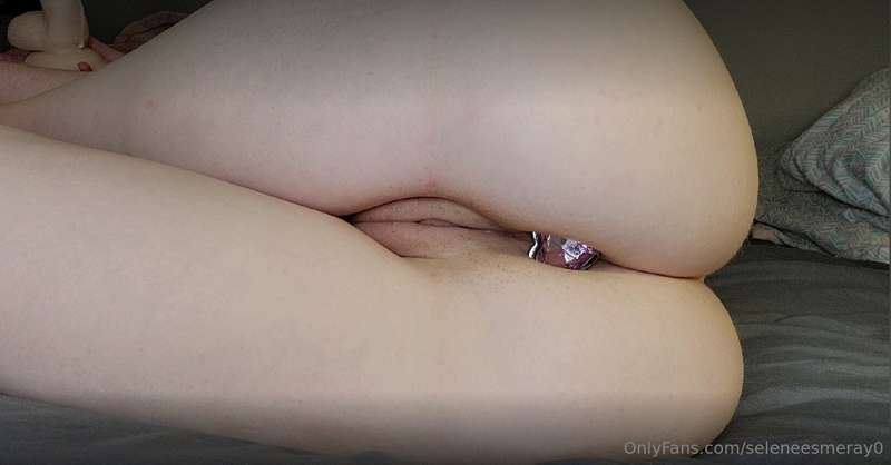 My ass 🍑 is stuffed with a pink heart plug 💗Laying on my sid..