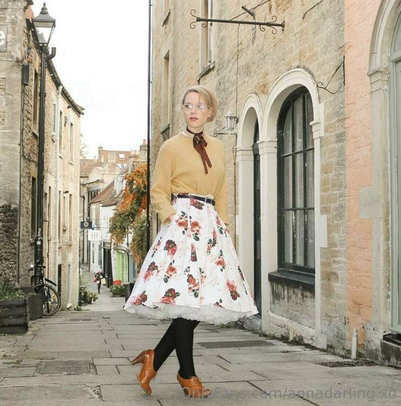 The pretty woman is cute, and she uses her skills to show of..