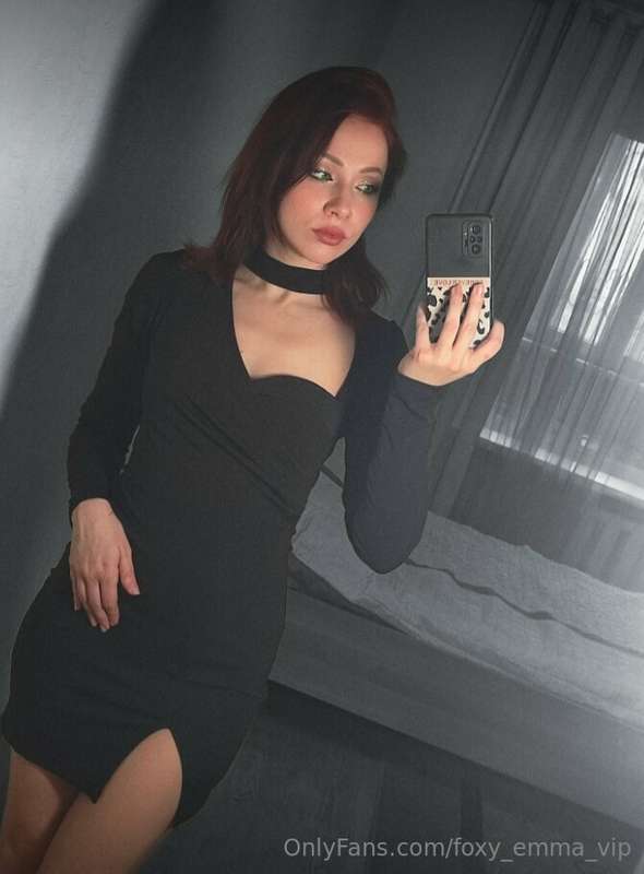 Draped in a sleek black dress, I am an embodiment of timeles..