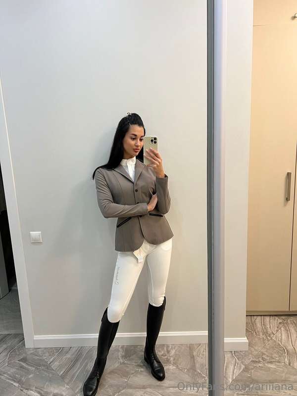 Love how my riding boots make my legs look—long and lean. Im..
