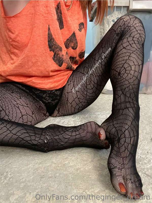 Spiderweb nylons , pumpkin shirt and a little black thong . ..