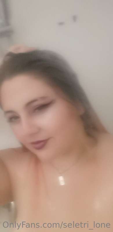 A very blurry shower selfie.