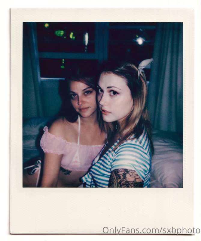 Polaroids of @aziebugx and @babyfilth, baby girls in bed tog..