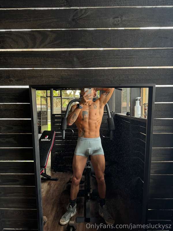 grey briefs showing off what’s underneath