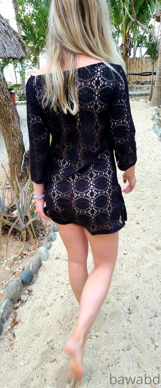 Walking down to the beach naked under a see through cover up..