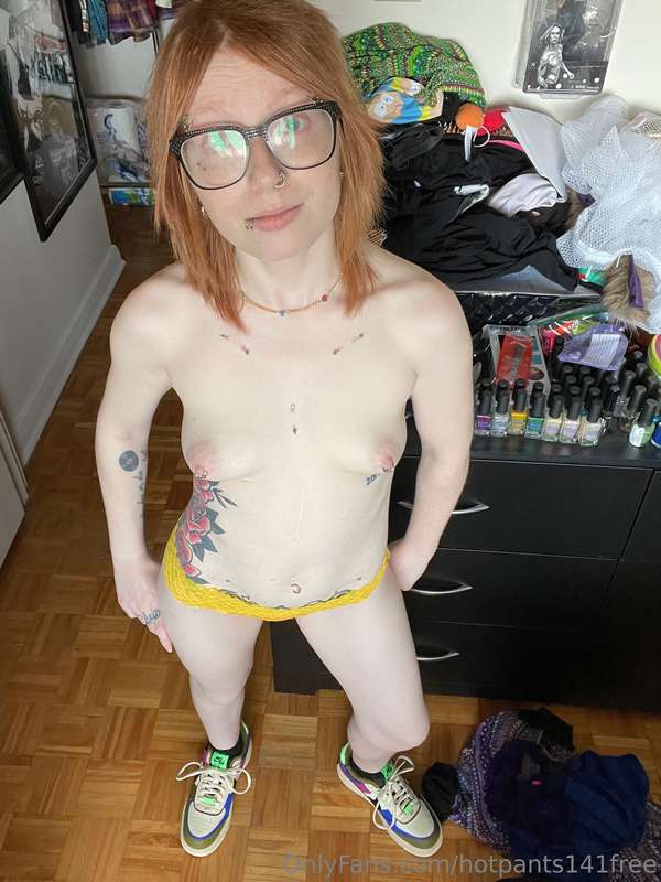 Just hanging out in my sneakers and my orange lace thong. 
