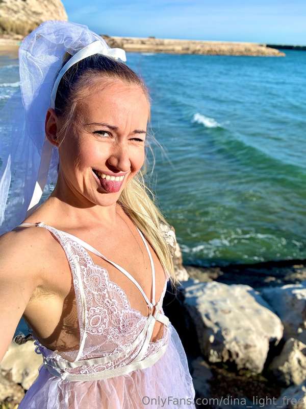 Wearing a wedding outfit by the sea – no groom in sight, but..