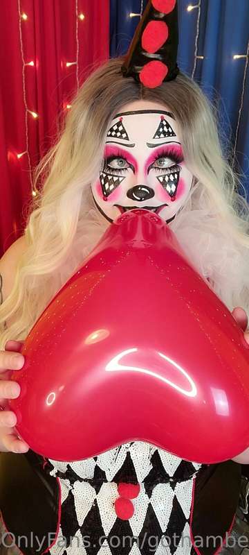 Watch Clue blow up a 10 inch red heart, 10 inch white heart,..